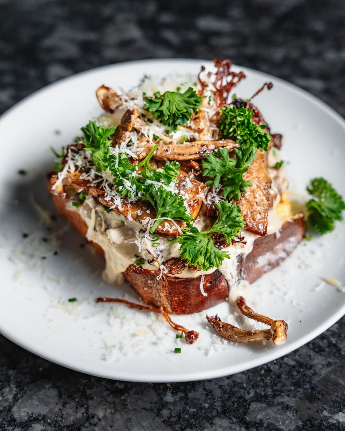 Toast piled with mushrooms, parsley and grated cheese