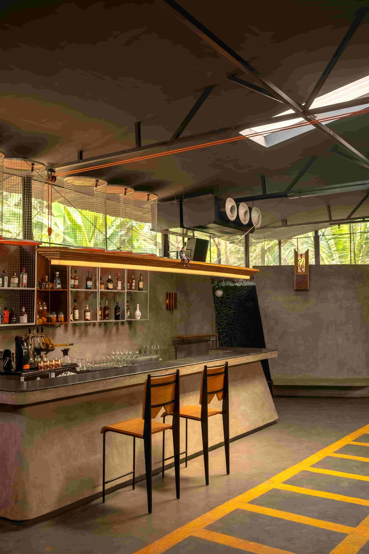 The bar counter in morning light, set up for breakfast